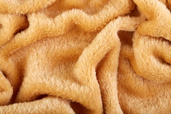 Texture of brown fluffy soft plush. Towel terry cloth, Soft texture cloth