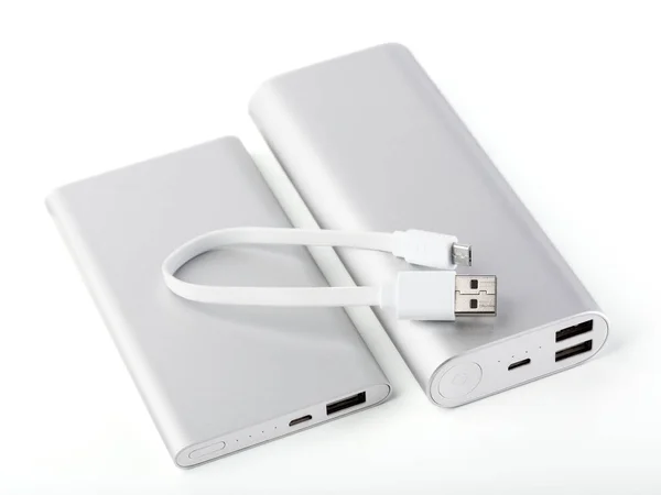 Power bank for charging mobile devices. White smart phone charger with power bank. battery bank. External battery for mobile devices.