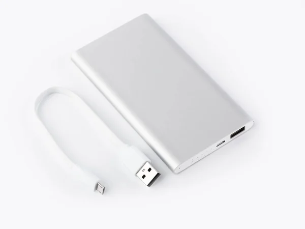 Power bank for charging mobile devices. White smart phone charger with power bank. battery bank. External battery for mobile devices.