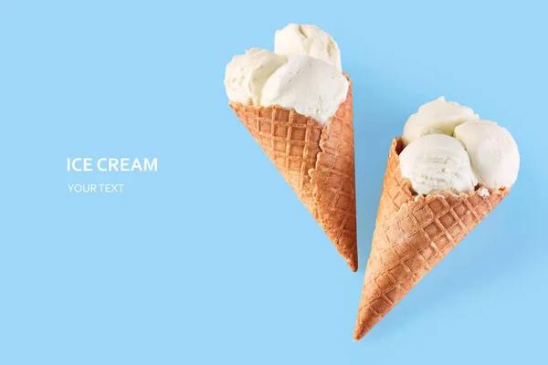 ice cream balls in a Waffle Cone on a Blue Background. Vanilla ice cream in a waffle cone.