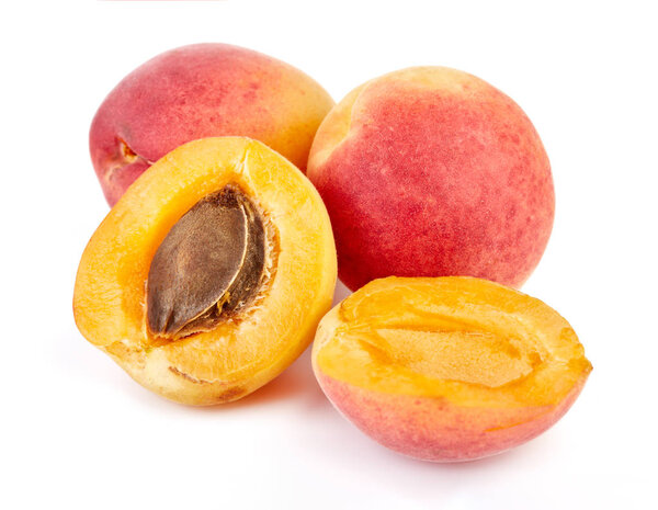 Isolated apricots. Fresh apricot fruit isolated on white background. Tropical abstract background. Fresh fruits. Place for your text.