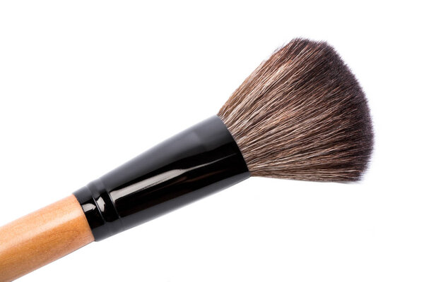 Various makeup brushes isolated over white. wooden makeup brushes. Duo fibre foundation makeup brush. Style. Fashion. Visage. Cosmetics.