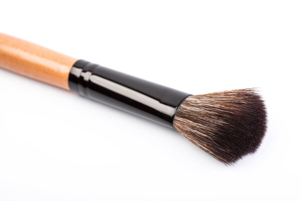 Various makeup brushes isolated over white. wooden makeup brushes. Duo fibre foundation makeup brush. Style. Fashion. Visage. Cosmetics.