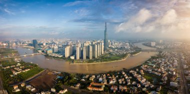 Aerial view of Ho Chi Minh City skyline and skyscrapers in center of heart business at Ho Chi Minh City downtown. Panorama of cityscape on Saigon river in Ho Chi Minh City at Vietnam at sunrise scene