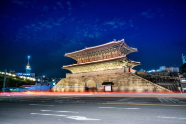 Dongdaemun Gate at night with light trails of Traffic in Seoul city, South Korea