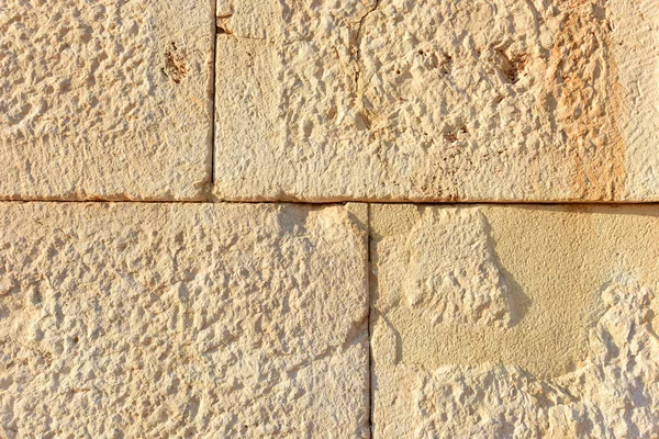 Kumtaşı yakın çekim büyük ışık blokları duvar. Antik Likya şehri Patara. Türkiye.