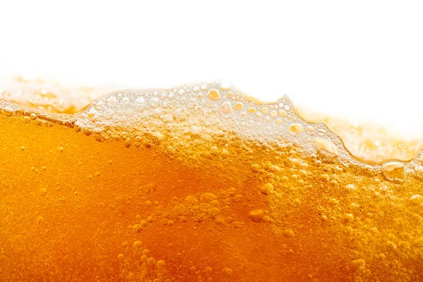 Parlak portakal yağını veya birayı kapat doku ve doğa dalgaları, güzel dalgalar eğrisi ve grafik tasarım ve arka plan için pürüzsüz küçük kabarcıklar, yağlı baloncuklar, yumuşak bira kabarcıkları, seçici odaklanma