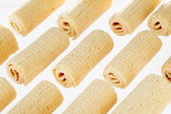 Wafer rolls. Gtoup of tasty crispy tube wafer on white background. Dessert.