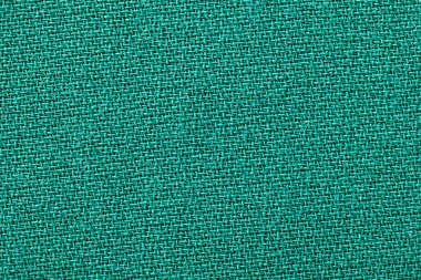 Yeşil kumaş arka plan doku. Detay tekstil malzeme yakın çekim.