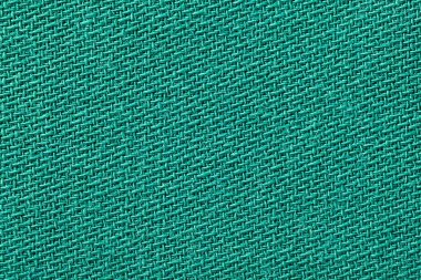 Yeşil kumaş arka plan doku. Detay tekstil malzeme yakın çekim.