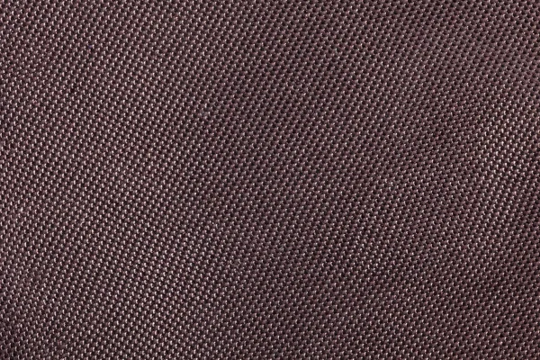 Dark brawn fabric background texture. Detail of textile material close-up.