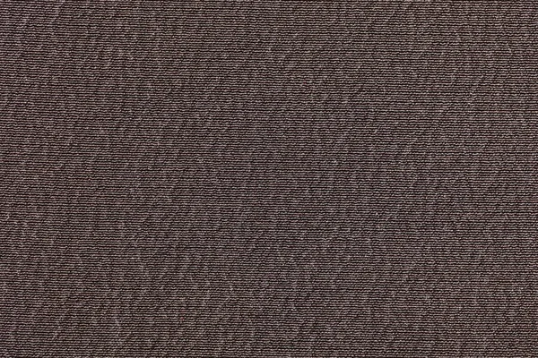Dark brawn fabric background texture. Detail of textile material close-up.