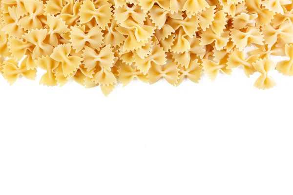 意大利面食的种类和形状多种多样 干面食背景 猎鹰弓的一部分意大利面在白色上被隔离了 白色背景下孤立的弓形领带面团 — 图库照片