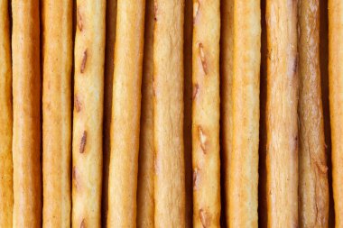 Hamurdan tuzlu ya da tatlı pipet, krakerden atıştırmalık, gevrek ekmek çubukları, arka planı kapatın.