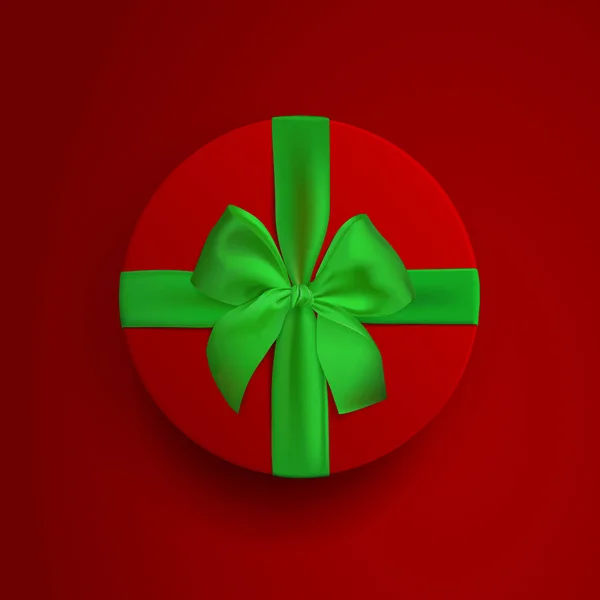 Κόκκινο στρογγυλό κουτί με πράσινη κορδέλα και φιόγκο που απομονώνονται σε κόκκινο φόντο. Πλαίσιο Προβολή επάνω κάλυμμα. Πρότυπο για το σχεδιασμό παρουσίασης, banner, φυλλάδιο ή αφίσα. Εικονογράφηση διάνυσμα. — Διανυσματικό Αρχείο