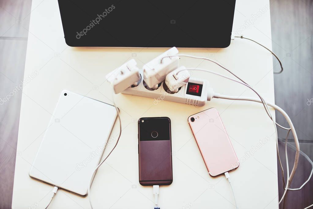Adapter for smartphone and laptop charging on the table