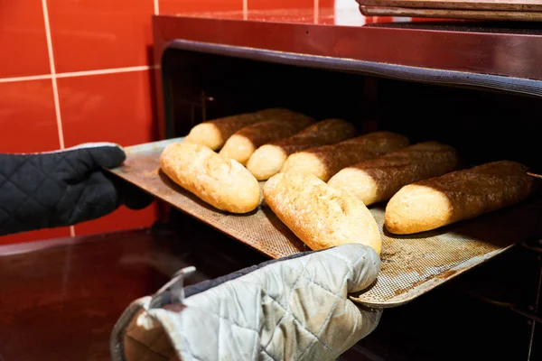 Baker Hands Potholder Taking Out Metal Cookie Sheet Bread Oven — Stock Photo, Image