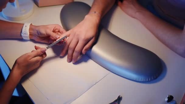 Beautician file customers nails — Stock Video