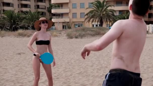 Slow Motion Young Couple Playing Smash Ball Beach Tennis Summer — Stock Video