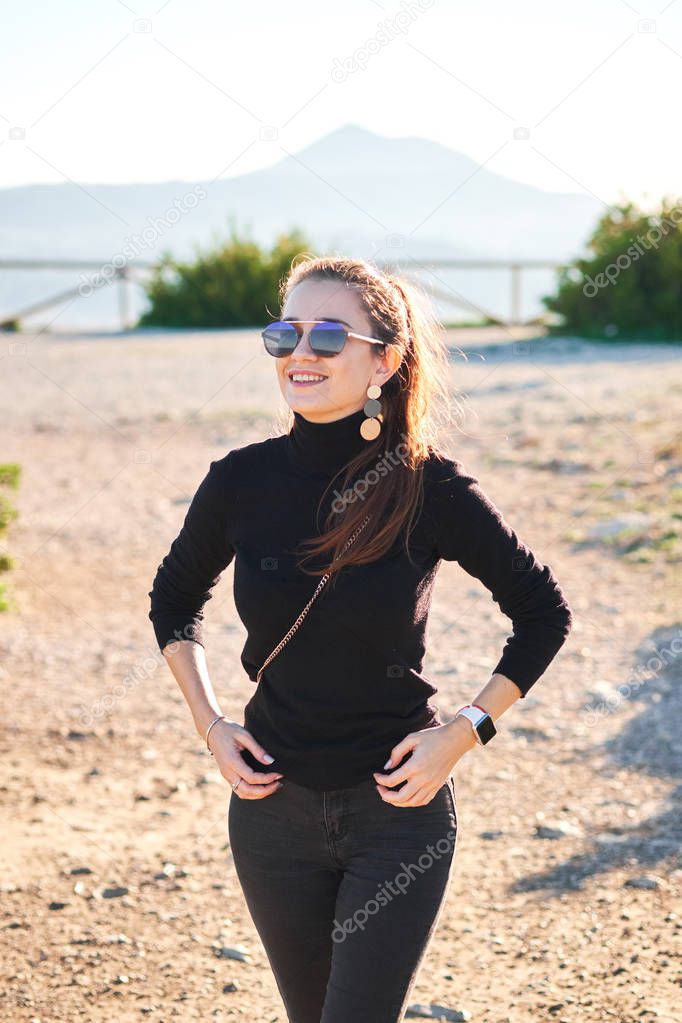 Young happy woman enjoying sunny day