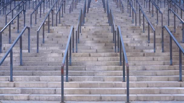 Long hair brunette girl is running down on the stairs morning exercise — Stock Video