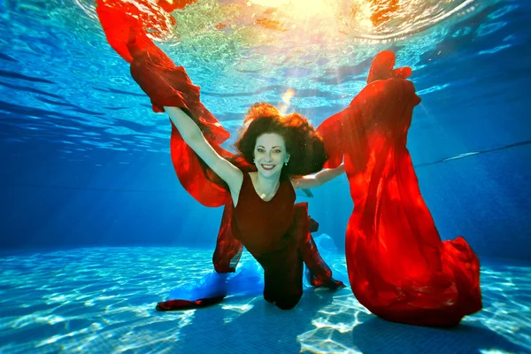 Beautiful Young Girl Swimming Underwater Rays Light She Plays Red — Stock Photo, Image