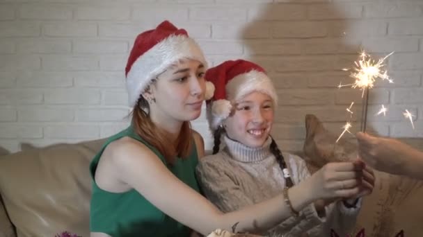 Children Hats Santa Claus Take Out Hands Mother Lit Sparklers — Stock Video