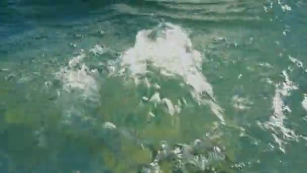 A small geyser of boiling water in the city fountain at sunset. Close up. The view from the top. 4K — Stock Video