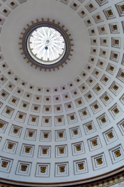 Architectural dome ceiling with intricate patterns in Temple of Canova  in Possagno Italy and a central skylight, showcasing detailed craftsmanship and design elements in a grand interior space