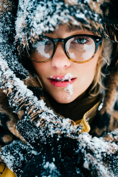 portrait of beautiful woman in eyeglasses in winter