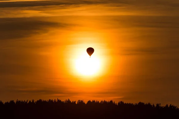 air balloon flying up in sky during beautiful sunset