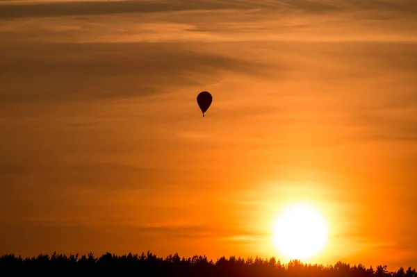 air balloon flying up in sky during beautiful sunset