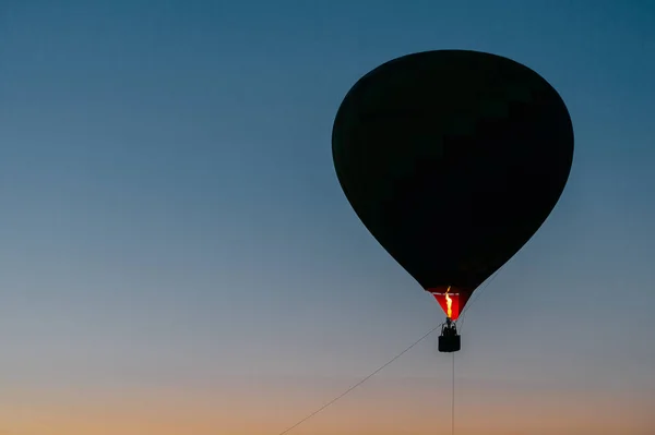 air balloon flying up in sky during beautiful sunset