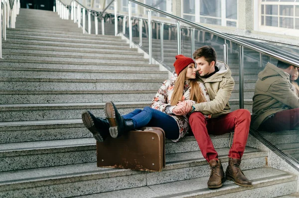 romantic couple in love sitting on stairs