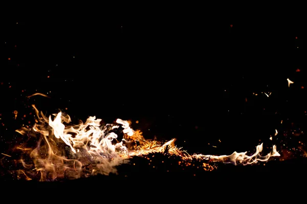 close up view of burning campfire as dark abstract background