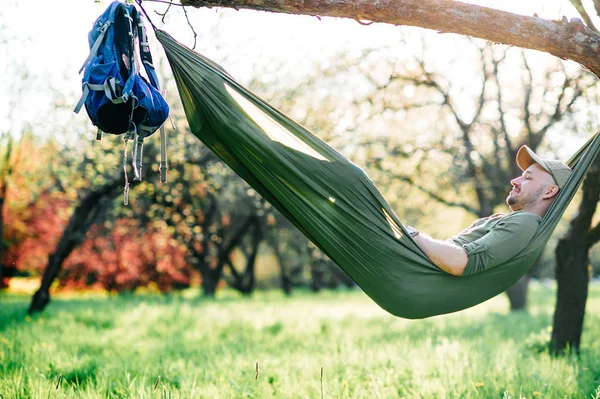 traveller resting in hammock on summer day