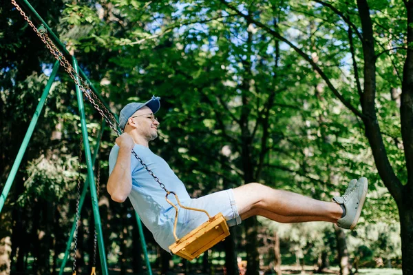 Adult Man Swinging Swing Playground Summer Park — Stock Photo, Image