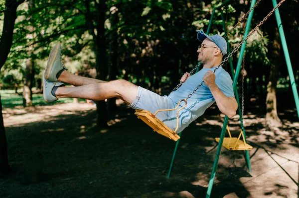 Adult Man Swinging Swing Playground Summer Park — Stock Photo, Image