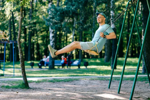 Adult Man Swinging Swing Playground Summer Park — Stock Photo, Image