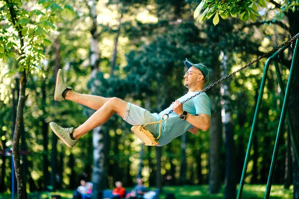 Adult Man Swinging Swing Playground Summer Park — Stock Photo, Image