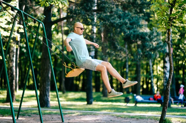 Adult Man Jumping While Swinging Swing Playground Summer Park — Stock Photo, Image