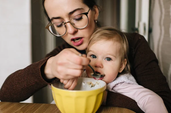 Mother Feeding Little Daughter Delicious Soup Home — Stock Photo, Image