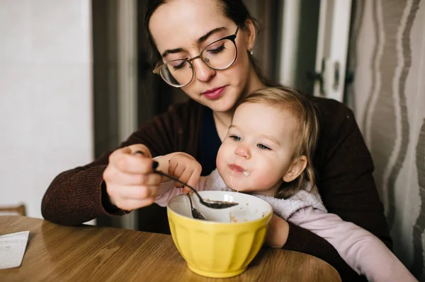 Mother Feeding Little Daughter Delicious Soup Home — Stock Photo, Image