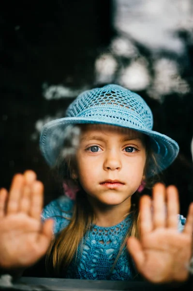 Little Girl Blue Knitted Dress Hat Looking Window — Stock Photo, Image