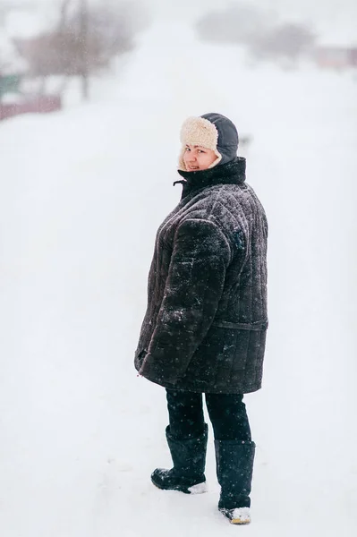 young woman in padded jacket in outdoor on winter day