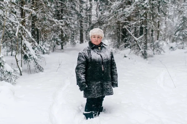 young woman in padded jacket in outdoor on winter day