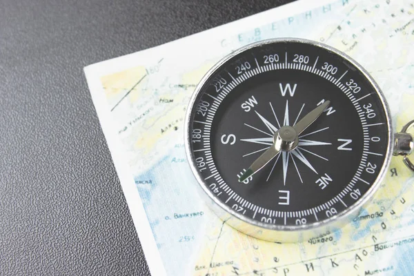 compass and map on the table