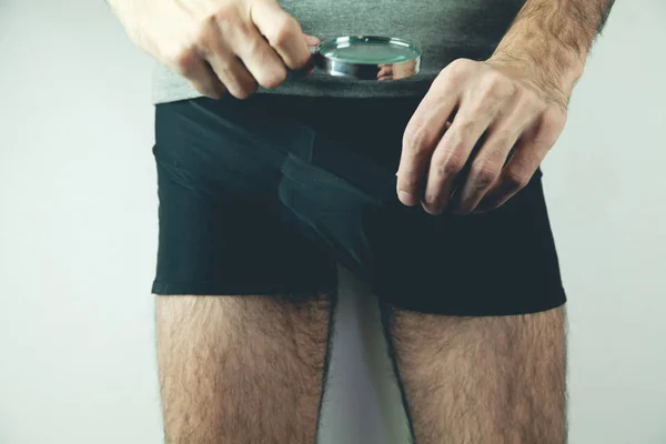 Man looking in his underwear — Stock Photo, Image