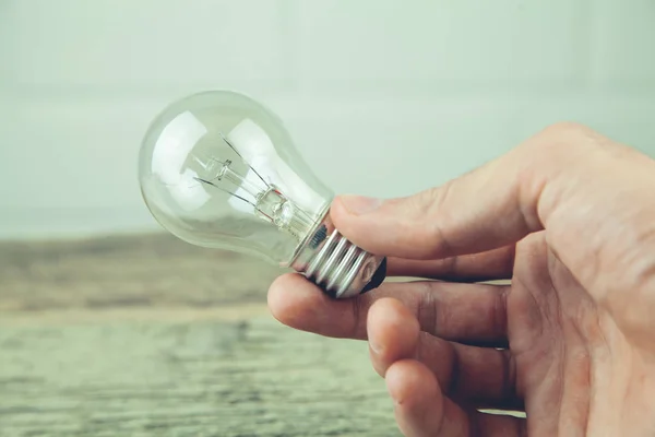 Businessman holding light bulb. Concept of new idea — Stock Photo, Image