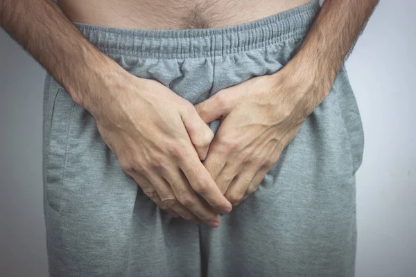 Man having a problem with his penis — Stock Image Man having a problem with his penis Royalty Free Stock Images